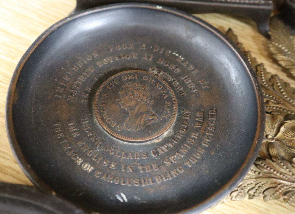 A group of 19th century iron and bronze ornaments, plaques, watch holder and urn